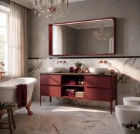 Il mobile bagno sospeso da 180 cm in finitura laccata opaca FB 96 radicchio è un elemento di design raffinato per il tuo bagno. Dotato di un lavabo in ceramica con vasca in appoggio e piano in HPL Alabastro Grey, questo mobile offre ampio spazio di archiviazione e un'estetica elegante. Completa l'ambiente con uno specchio con cornice in legno, luce LED e sensore di accensione.