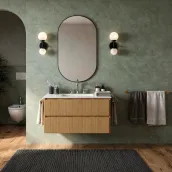 Elevate your bathroom with this sleek, 80cm wide suspended vanity in Natural Wood Rovere laminate finish, featuring a spacious interior and a stylish, 1.2cm thick opal white Tecnoril countertop with an integrated Pf1240 ocritech white basin. The unit boasts a sturdy design, with a 50cm height and 46cm depth, and comes complete with a chic, grooved handle and a matching, curved 2cm thick mirror, 75cm high and 60cm wide.
