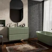 Elevate your bathroom with this sleek, 80cm wide suspended vanity, lacquered in a sophisticated opac RAL 6003 finish. The unit boasts a generous depth of 46cm and a height of 50cm, with a spacious interior and ample room on either side. The vanity features a 1.2cm thick Tekhnos RAL 6003 top with an integrated Mv80 washbasin and a pre-drilled tap hole, perfectly complemented by a curved, 2cm thick mirror, 75cm high and 60cm wide.